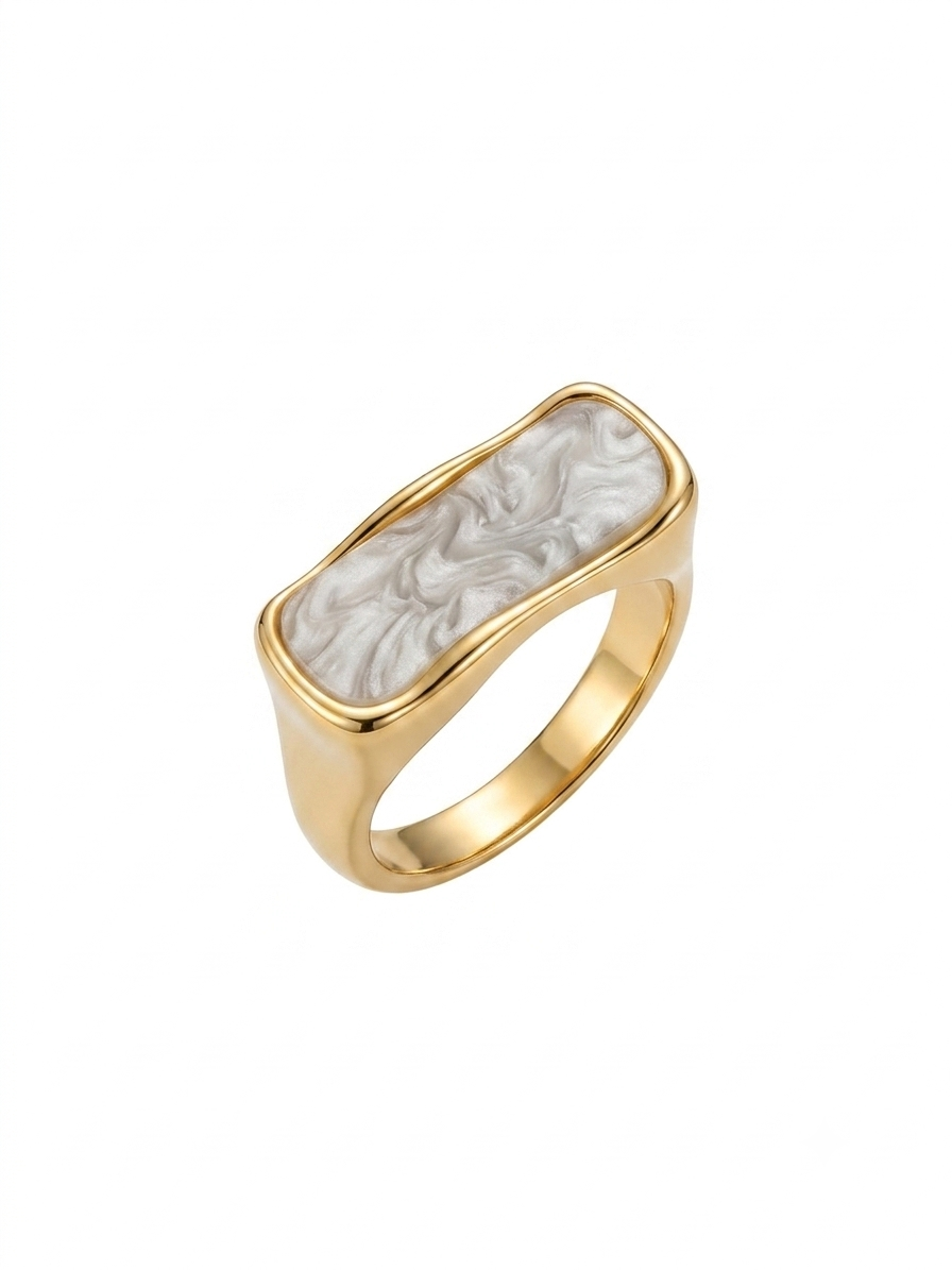 A gold signet ring featuring a rectangular, bezel-set white mother-of-pearl inlay with a raised wave pattern, shown on a plain white background.