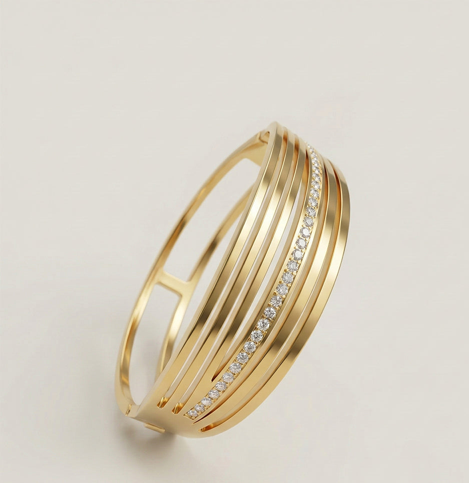 Angled view of a polished anti-tarnish layered gold cuff bracelet with shimmering crystals for women