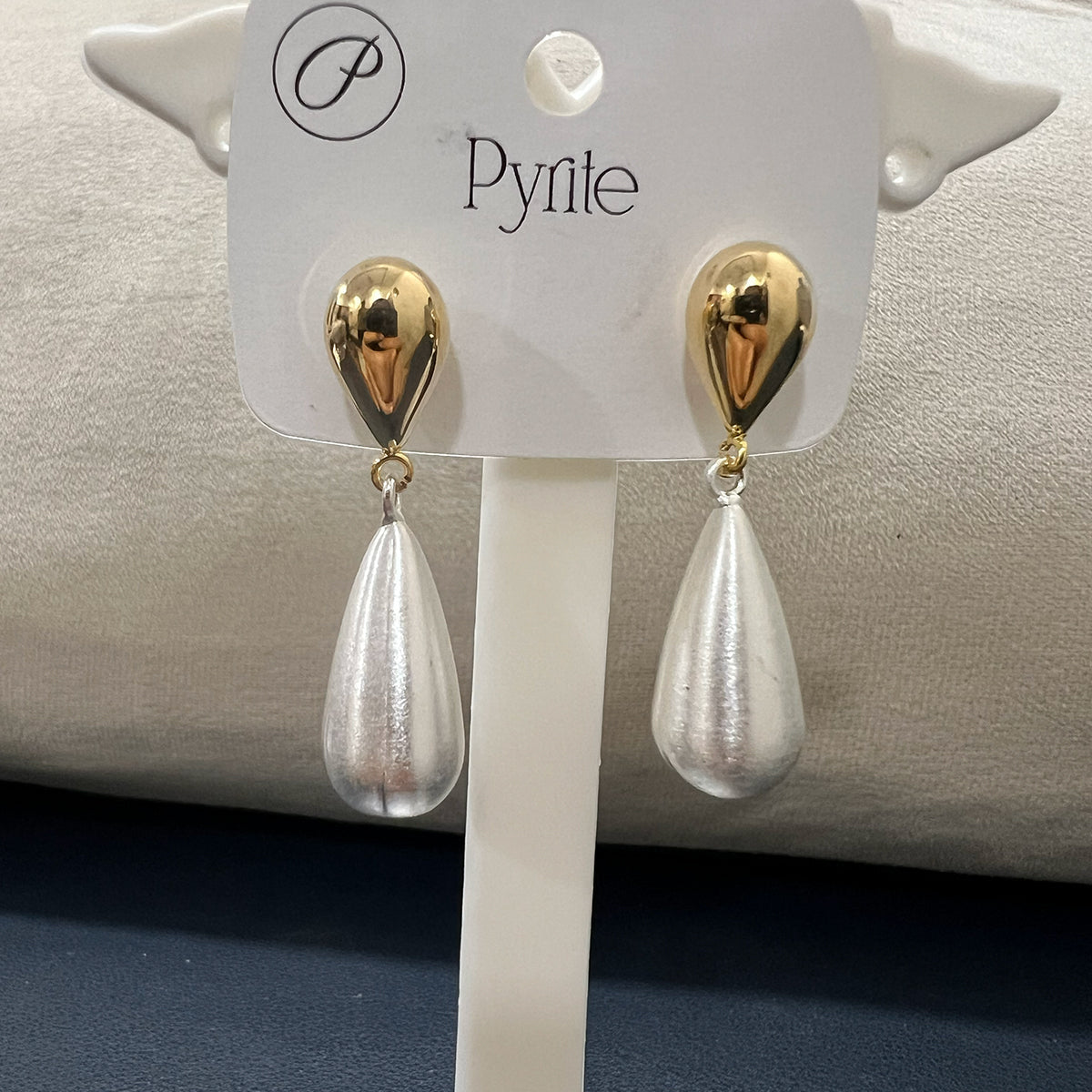 Elegant brushed gold oval drop earrings crafted in stainless steel with a unique textured matte finish