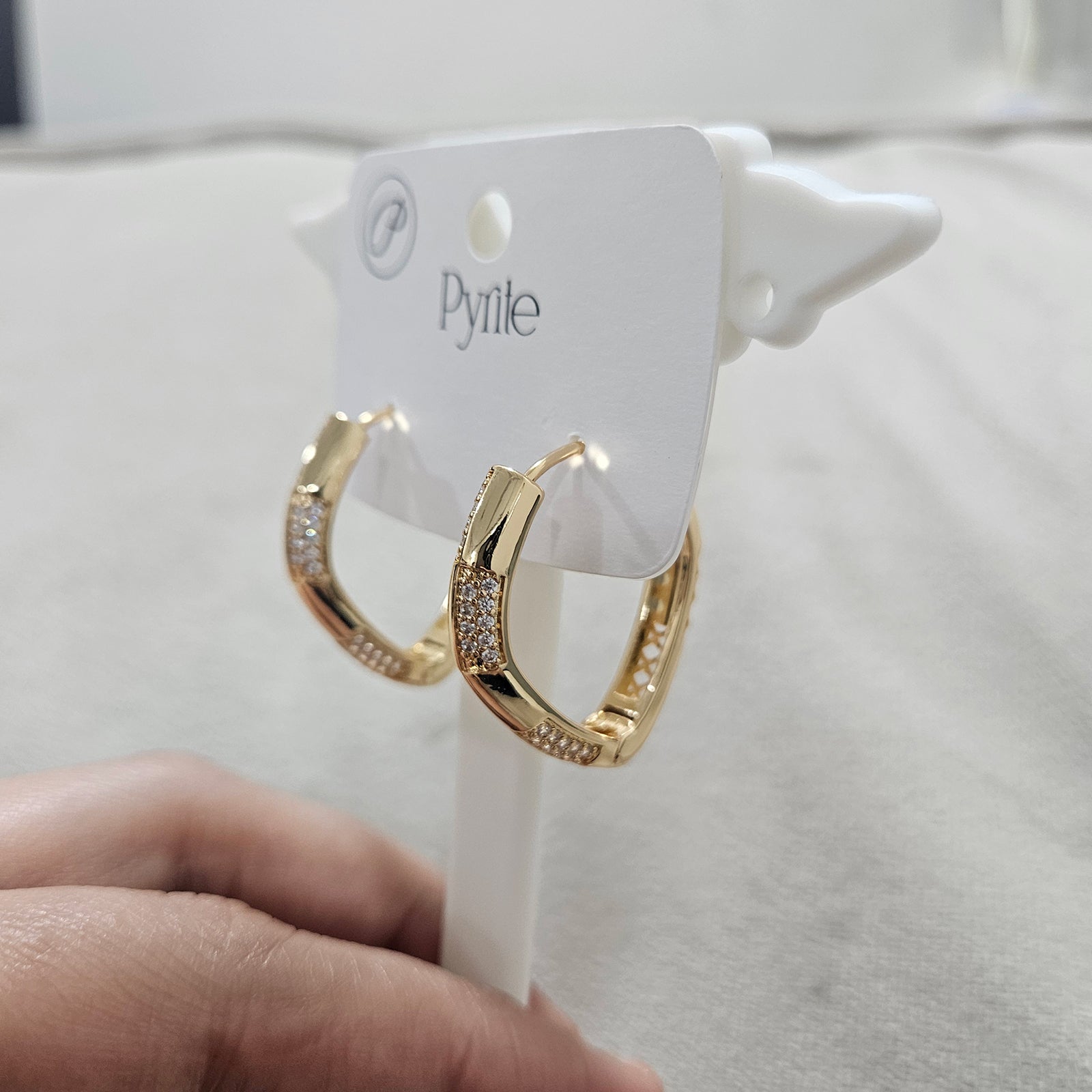 Side view of anti tarnish stainless steel gold earrings showing the unique angular design and polished finish Zwelzy Designs